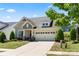 Beautifully landscaped home with manicured lawn and a two-car garage in a desirable neighborhood at 199 Blossom Ridge Dr, Mooresville, NC 28117