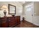 Inviting foyer featuring dark hardwood floors, elegant trim, and a stylish console table at 199 Blossom Ridge Dr, Mooresville, NC 28117