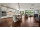 Open-concept kitchen flowing into the living area with a large island and modern appliances at 199 Blossom Ridge Dr, Mooresville, NC 28117