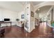 Spacious living room showcasing hardwood floors and a view of the entry and staircase at 199 Blossom Ridge Dr, Mooresville, NC 28117