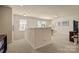 Bright loft space with neutral carpeting, natural light, and versatile layout at 199 Blossom Ridge Dr, Mooresville, NC 28117