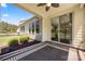 Covered patio featuring a ceiling fan, beautiful brickwork, and outdoor seating area at 199 Blossom Ridge Dr, Mooresville, NC 28117