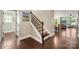 Elegant staircase with carpeted steps and dark wood railing, leading to the upper level at 199 Blossom Ridge Dr, Mooresville, NC 28117