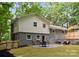 Charming backyard patio with dining and sitting area, perfect for relaxing and entertaining, plus a fenced in yard at 2009 Edgewater Dr, Charlotte, NC 28210