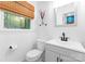 Well-lit bathroom with a modern sink, toilet, and vanity, offering a clean and functional space at 2009 Edgewater Dr, Charlotte, NC 28210