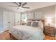 Bright bedroom featuring a ceiling fan, closet space, and ample natural light from the window at 2009 Edgewater Dr, Charlotte, NC 28210