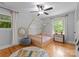 Bright bedroom featuring a unique toddler bed frame and a cozy reading corner at 2009 Edgewater Dr, Charlotte, NC 28210