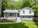 Charming two-story home featuring updated paint, black trim, and a well-manicured front lawn at 2009 Edgewater Dr, Charlotte, NC 28210
