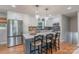 Stylish kitchen with stainless steel appliances, island seating, and a view from the window at 2009 Edgewater Dr, Charlotte, NC 28210