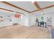 Spacious living room with built-in shelving, a dedicated office space, and ample natural light at 2009 Edgewater Dr, Charlotte, NC 28210