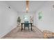 Comfortable office with natural light and a view of the outdoors, featuring a desk and shelving at 2009 Edgewater Dr, Charlotte, NC 28210