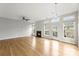 Open living room with hardwood floors, fireplace, and abundant natural light at 2151 Belle Vernon Ave, Charlotte, NC 28210