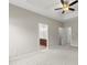 Large main bedroom featuring tray ceiling and carpet with adjacent ensuite bathroom at 2151 Belle Vernon Ave, Charlotte, NC 28210