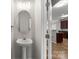 Cozy powder room with pedestal sink and modern fixtures, conveniently located at 2151 Belle Vernon Ave, Charlotte, NC 28210