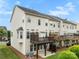 Back exterior view of townhouses featuring wood decks, patios, and vinyl siding at 2151 Belle Vernon Ave, Charlotte, NC 28210