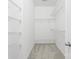 Spacious walk-in closet with ample shelving for optimal storage solutions at 2151 Belle Vernon Ave, Charlotte, NC 28210