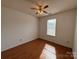 Bedroom with ceiling fan, laminate floor, and window with blinds at 2504 Faircroft Way, Monroe, NC 28110
