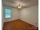 Bedroom featuring a window with blinds, a ceiling fan and hardwood flooring at 2504 Faircroft Way, Monroe, NC 28110