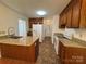 Spacious kitchen equipped with granite countertops, modern appliances, and wood cabinetry for ample storage at 2504 Faircroft Way, Monroe, NC 28110