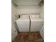 Bright laundry room with a washer and dryer setup and convenient shelf space at 2504 Faircroft Way, Monroe, NC 28110