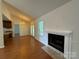Cozy living area with fireplace, vaulted ceilings, hardwood floors, opening to the kitchen and outdoor living at 2504 Faircroft Way, Monroe, NC 28110