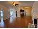Open-concept living area features hardwood floors, high ceilings, with easy access to kitchen and backyard at 2504 Faircroft Way, Monroe, NC 28110