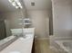 Bathroom featuring double sinks, shower and tub at 2504 Faircroft Way, Monroe, NC 28110