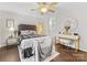 Well-lit primary bedroom boasts a ceiling fan, vanity and hardwood floors at 2719 Selwyn Ave # 20, Charlotte, NC 28209