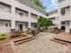 Charming courtyard with benches and landscaping at 2719 Selwyn Ave # 20, Charlotte, NC 28209