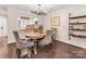 Elegant dining room with modern chandelier and comfortable seating, adjacent to kitchen at 2719 Selwyn Ave # 20, Charlotte, NC 28209