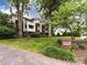 Beautiful condo building with manicured lawns and mature trees offers a serene and inviting entrance at 2719 Selwyn Ave # 20, Charlotte, NC 28209