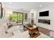 Inviting living room features a fireplace and sliding glass doors to a private balcony at 2719 Selwyn Ave # 20, Charlotte, NC 28209