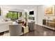 Bright living room featuring a fireplace, hardwood floors, and sliding glass doors to a private balcony at 2719 Selwyn Ave # 20, Charlotte, NC 28209