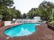 Community pool with brick trim and plenty of deck space at 2719 Selwyn Ave # 20, Charlotte, NC 28209