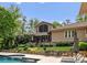 Beautiful backyard with a pool, patio furniture, and well-maintained landscaping, perfect for outdoor living at 2915 Cutter Ct, Waxhaw, NC 28173