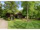 Lovely home surrounded by lush greenery and landscaping, featuring a well-manicured lawn at 2915 Cutter Ct, Waxhaw, NC 28173