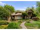 Charming home featuring stone accents, lush landscaping, and a manicured lawn at 2915 Cutter Ct, Waxhaw, NC 28173