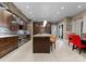 Beautiful kitchen with stone accent wall, stainless steel appliances, and an island with barstool seating at 2915 Cutter Ct, Waxhaw, NC 28173