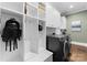 Well-equipped laundry room with washer, dryer, storage and organization space at 2915 Cutter Ct, Waxhaw, NC 28173
