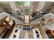 Expansive living area with soaring ceilings, grand staircases, and stylish furnishings beneath ample windows at 2915 Cutter Ct, Waxhaw, NC 28173
