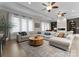 Bright living room with fireplace, sectional sofa, and large windows at 2915 Cutter Ct, Waxhaw, NC 28173