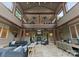 Outdoor living space with a fireplace, ample seating, and a balcony above at 2915 Cutter Ct, Waxhaw, NC 28173