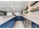 Contemporary wet bar with custom cabinets, quartz countertops, and stylish shelving at 2915 Cutter Ct, Waxhaw, NC 28173