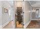 Elegant wine cellar with glass enclosure and custom bottle storage at 2915 Cutter Ct, Waxhaw, NC 28173