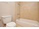 This bathroom features a shower-tub combo and a toilet at 316 Anne Ave, Waxhaw, NC 28173