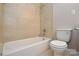This bathroom features a standard toilet and a tub/shower combo with tile surround at 316 Anne Ave, Waxhaw, NC 28173