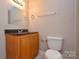 This bathroom has a granite-look vanity, toilet, and neutral walls at 316 Anne Ave, Waxhaw, NC 28173