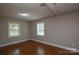 This bedroom offers laminate floors and two windows, allowing for natural light at 316 Anne Ave, Waxhaw, NC 28173