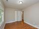 This bedroom has wood-look flooring, closet, and a window for natural light at 316 Anne Ave, Waxhaw, NC 28173