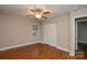 This bedroom offers wood-look floors, a closet, and a ceiling fan at 316 Anne Ave, Waxhaw, NC 28173
